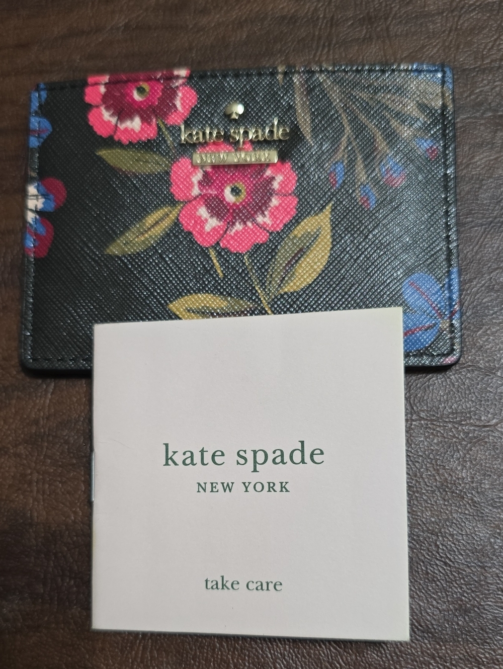 Kate Spade Cameron Street Meadow Black Floral Card Case with Pink & Blue Blooms.